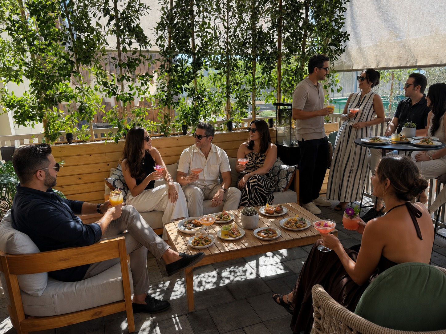 Guests enjoying drinks and small plates on the BLU Seafood Gilbert patio