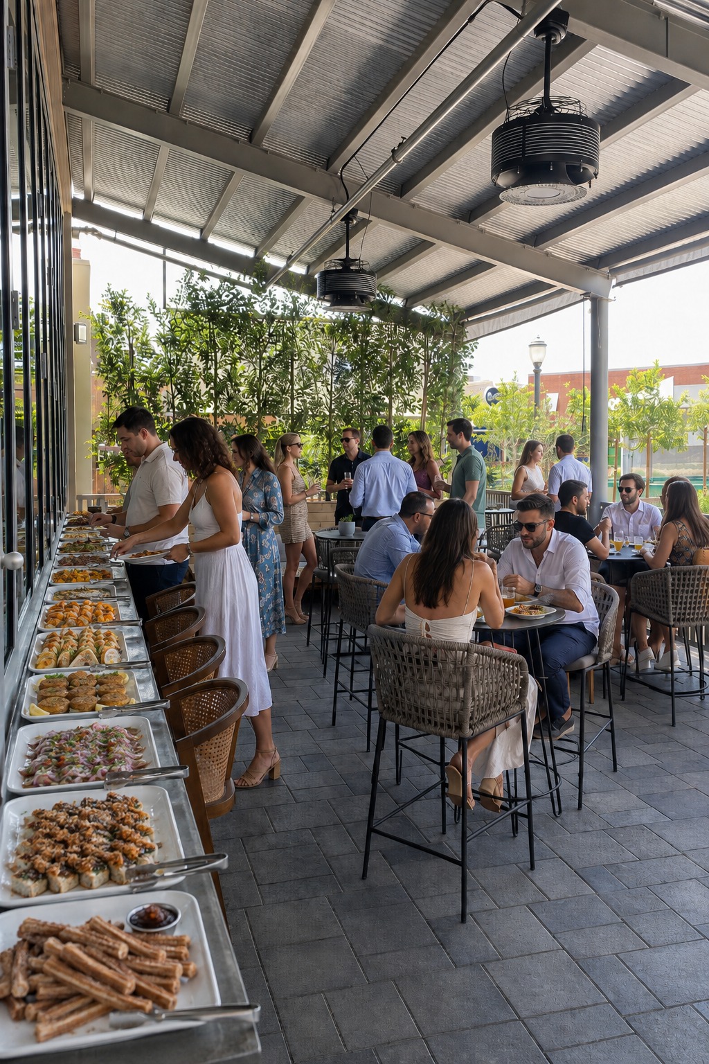 A catered buffet and guests on the BLU Seafood Gilbert patio
